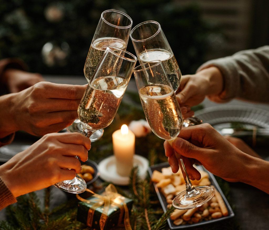 Glasses clinking at a festive table